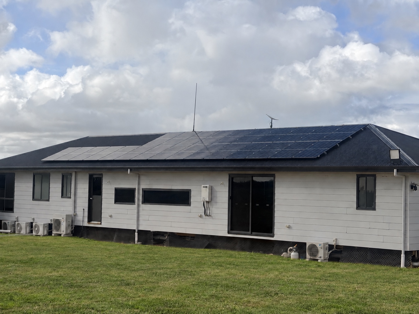 Main home with its roof-mounted solar array
